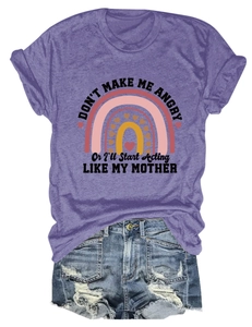 Detail of purple graphic t-shirt with rainbow print paired with frayed denim shorts