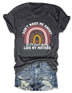 Flat lay of heather grey t-shirt with rainbow print and distressed denim shorts