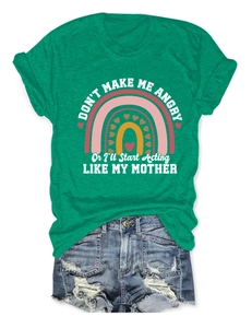 Detail of green T-shirt with humorous slogan and rainbow graphic design for women
