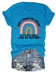Flat lay of peacock blue T-shirt with rainbow print and ripped denim shorts set
