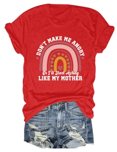 Flat lay of red cotton t-shirt with rainbow print and distressed denim shorts