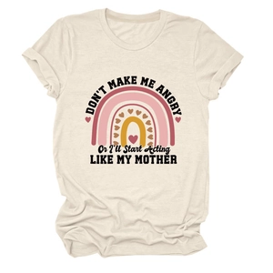 Close-up of funny rainbow print and lettering on a cream cotton short sleeve t-shirt