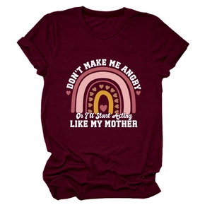 Close-up of printed slogan and rainbow design on maroon cotton crew neck T-shirt
