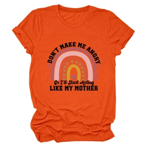 Detail of soft orange cotton T-shirt featuring rainbow print and humorous quote text