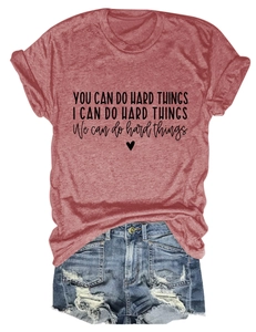 Close-up of inspirational typography and heart print on a rust red cotton T-shirt