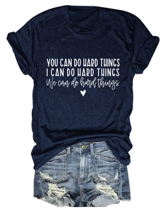 Navy t-shirt with You Can Do Hard Things text paired with ripped denim shorts