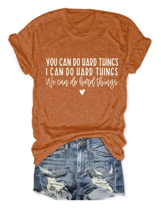 Detail of burnt orange t-shirt with 'You Can Do Hard Things' quote and heart print