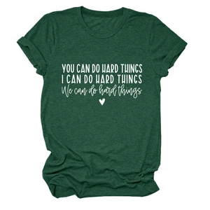 Detail of rolled sleeves and white heart print on a dark green textured cotton T-shirt