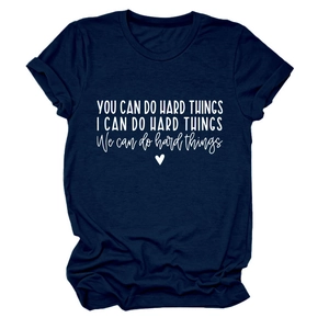 Detail of inspirational quote prints on a navy blue round neck short sleeve cotton T-shirt