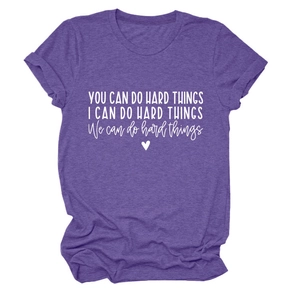 Detail of purple crew neck t-shirt featuring white motivational text and a small heart