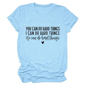 Detail of inspirational quote printing on light blue cotton crewneck t-shirt
