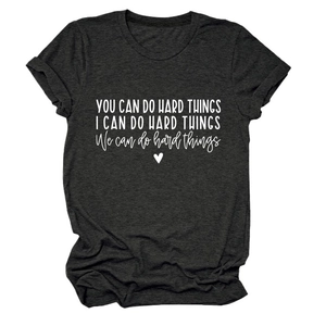 Detailed flat lay of dark gray crew neck T-shirt featuring motivational white typography