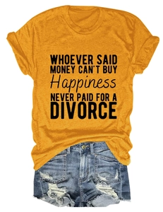 Detailed flat lay of mustard yellow t-shirt with quotes and distressed blue denim shorts