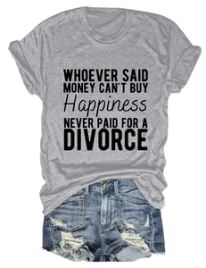 Flat lay of gray crew neck T-shirt with quote and distressed denim shorts on white background