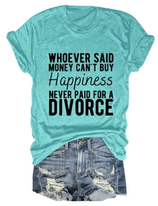 Flat lay of women's mint green t-shirt with text and distressed blue denim shorts