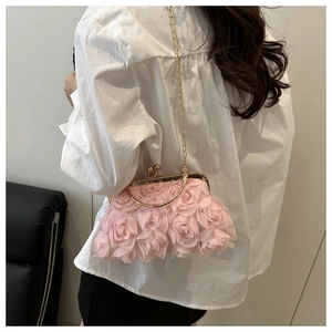 Detail of 3D rose flower evening bag with gold chain strap and vintage metal clasp