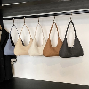 Five assorted woven hobo handbags in grey-blue, beige, white, caramel and black tones