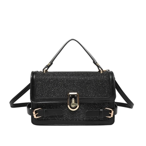 Elegant black glitter crossbody bag with gold hardware and top handle for women