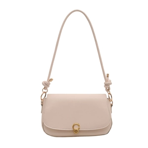 Minimalist beige saddle shoulder bag for women with round golden buckle and knotted strap