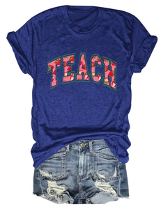 Detail of TEACH strawberry print t-shirt paired with distressed denim shorts