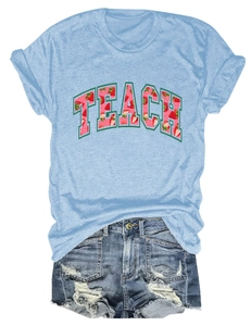 Detail of light blue Teach strawberry print T-shirt paired with frayed denim shorts