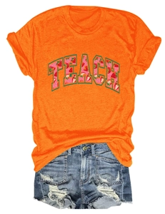 Detail of TEACH strawberry print on orange T-shirt with blue distressed denim shorts set