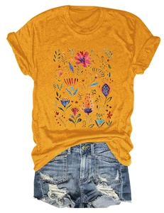 Detailed flat lay of yellow cotton T-shirt with vibrant red flower print and blue leaves
