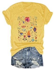 Flat lay of women yellow floral T-shirt and distressed denim shorts for summer outfits