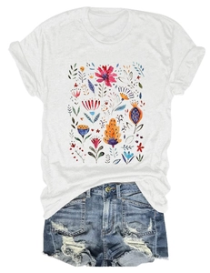 Detailed view of women's white T-shirt with floral print and frayed denim shorts