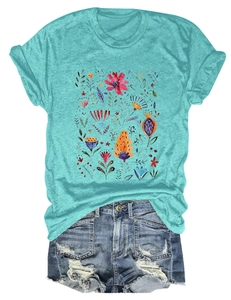 Close-up of floral print t-shirt paired with frayed denim shorts on white background