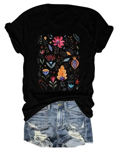 Flat lay of women's black cotton t-shirt with floral print and denim shorts