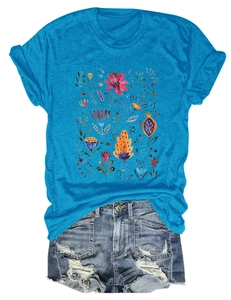 Detail of sky blue round neck t-shirt with watercolor floral print and denim shorts