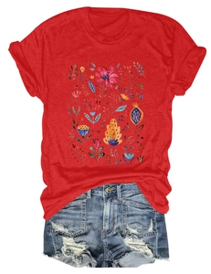 Detail of red floral t-shirt with watercolor flower prints and distressed denim shorts