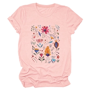 Detailed view of colorful watercolor floral print on pink cotton crewneck T-shirt
