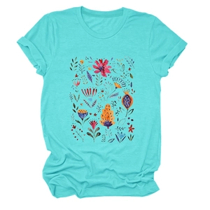 Detail of red floral print and rolled cuff on a light blue crew neck cotton T-shirt