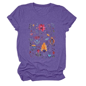 Close-up of colorful floral art print on a purple cotton blend short sleeve t-shirt