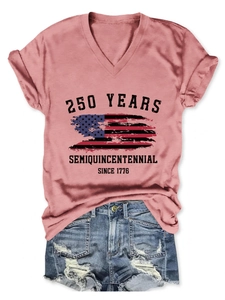 Close-up of V-neck shirt with 250 Years Semiquincentennial print and denim shorts