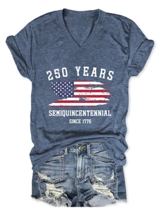 Close-up of Semiquincentennial 250 Years print on navy V-neck tee and frayed denim shorts