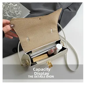 Detail of the woven straw crossbody bag interior showing storage space for essentials