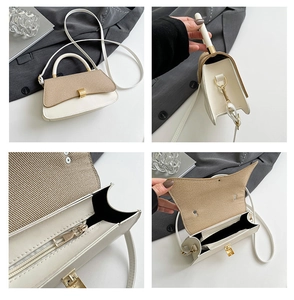 Detailansicht der modischen kleinen Tasche mit geschwungenem Boden und Goldakzenten