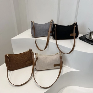 Retro textured woven underarm bag with leather straps in four minimalist colors