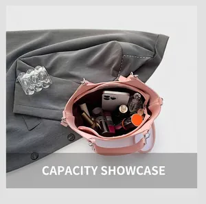 Macro view of the pink silk bucket bag interior showing large storage capacity