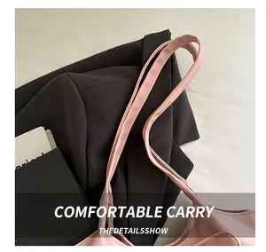 Detail view of pink tote bag showing comfortable wide handle with neat stitching craft