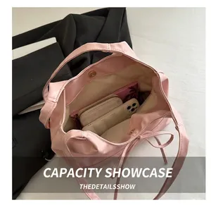 Top view of the pink faux leather tote bag interior showing large storage capacity