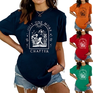 Multiple colors of Just One More Chapter T-shirts with skull reading book graphic