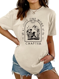 Detail of Just One More Chapter print on beige cotton T-shirt with gothic skeleton reading