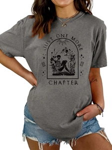 Detail of dark grey cotton t-shirt with skull reading print and Just One More Chapter text