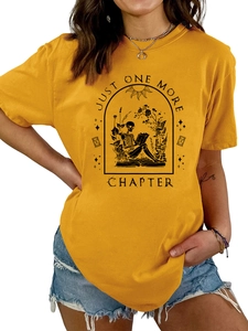 Detail of Just One More Chapter slogan and skull reading graphic on yellow cotton T-shirt