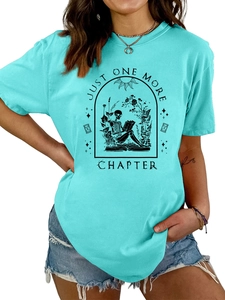Close-up of vintage skeleton reading book print on turquoise cotton t-shirt fabric