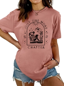 Detail of Just One More Chapter graphic with reading skeleton and floral motifs on T-shirt